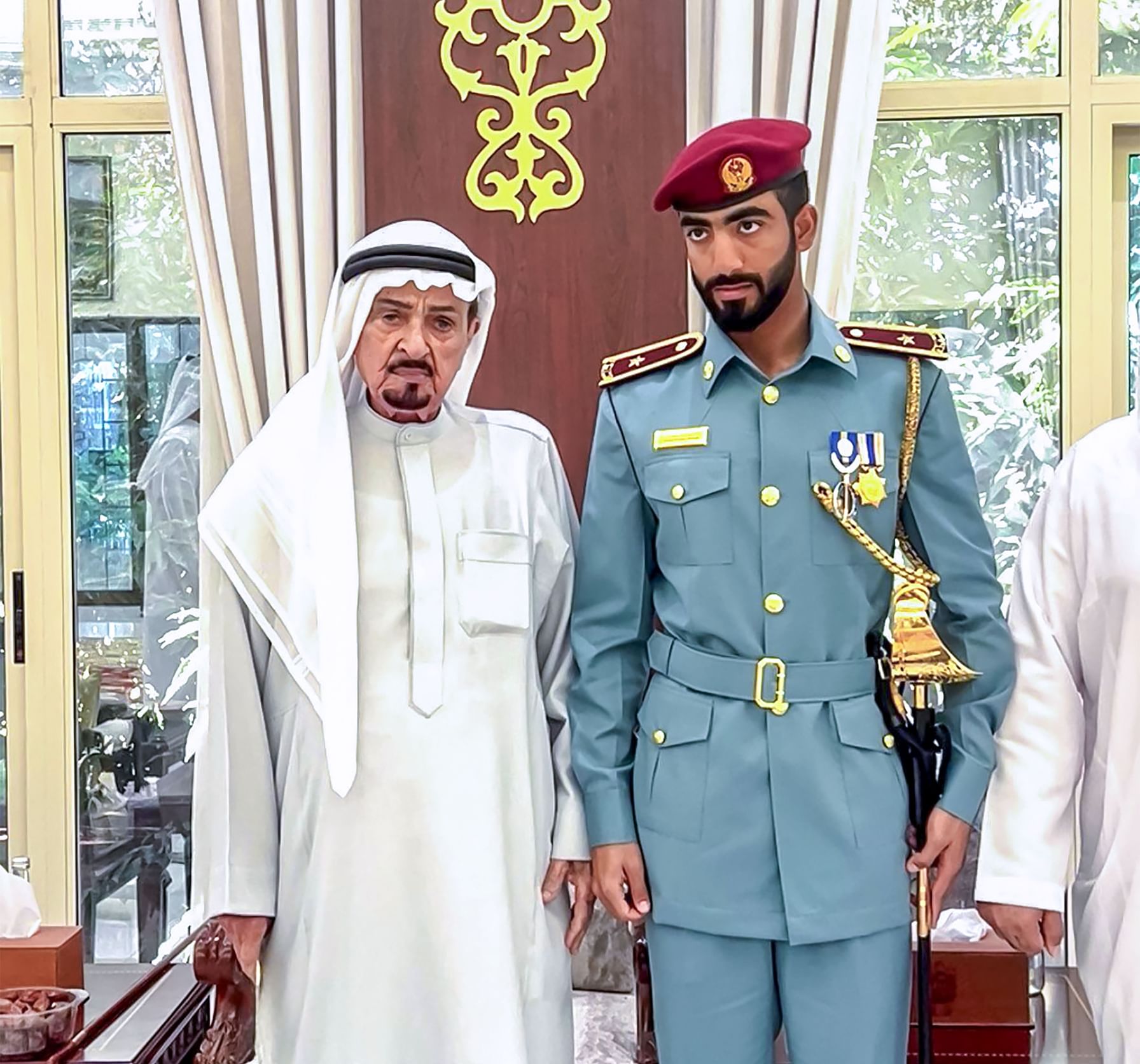 Humaid bin Rashid receives Officer Cadet Obaid Al Kaabi, winner of Sword of Honour from Police College