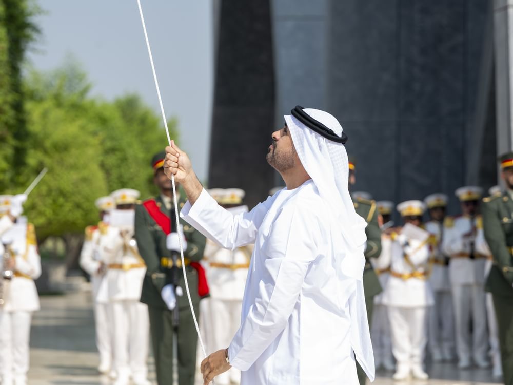 Theyab bin Mohamed bin Zayed raises UAE flag at Wahat Al Karama to mark Flag Day