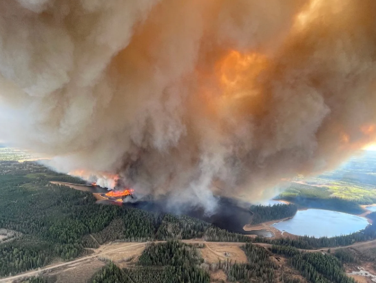 Canada evacuates thousands as wildfires intensify