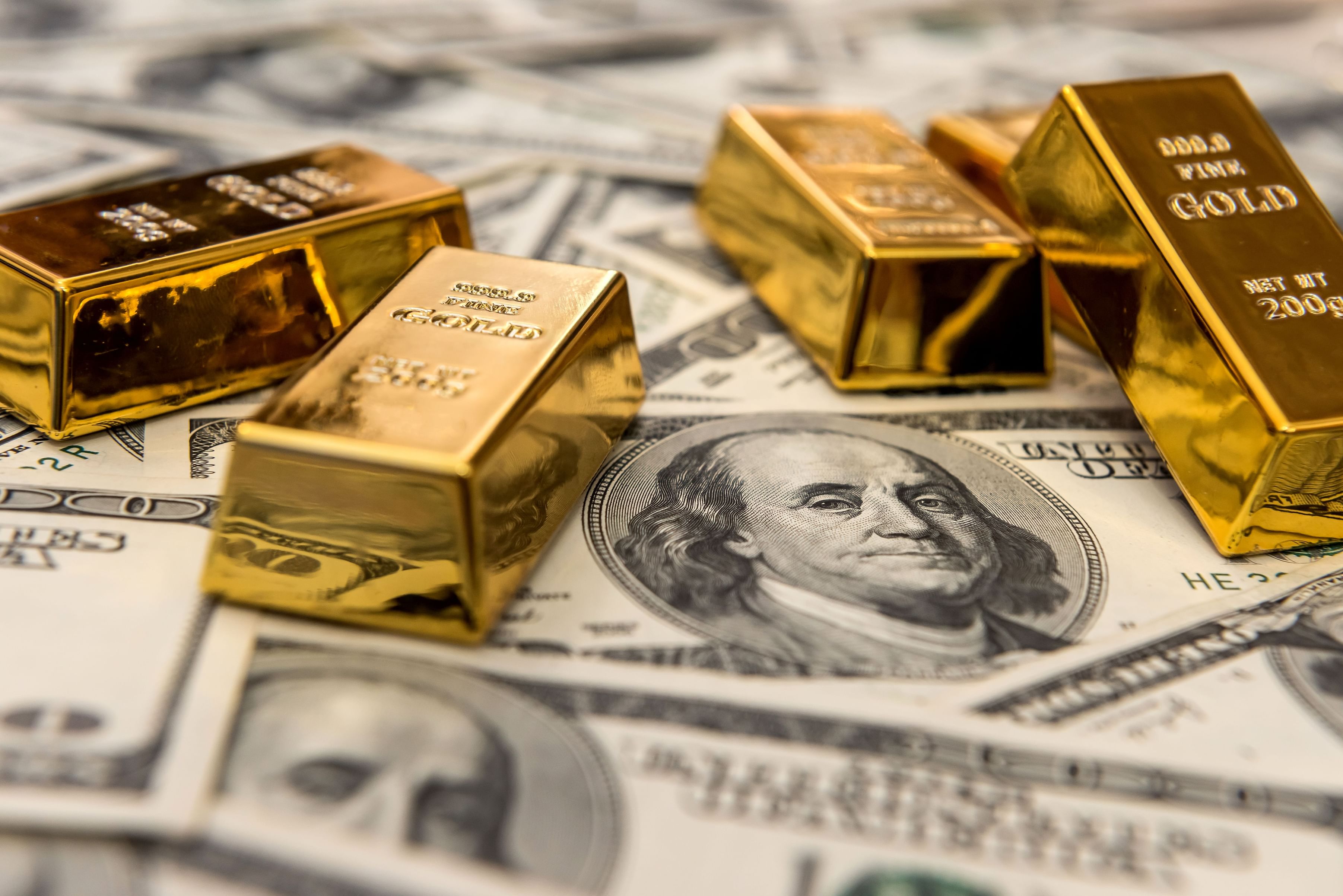 Gold gains on softer dollar